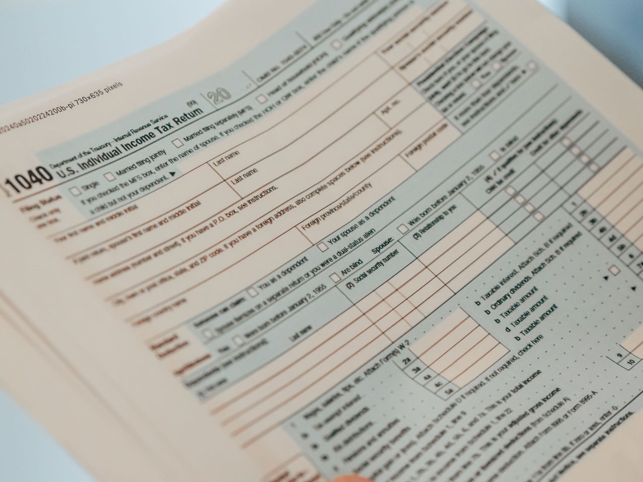 services-03 Detailed close-up image of a U.S. 1040 Individual Income Tax Return form, ideal for finance-related content.
